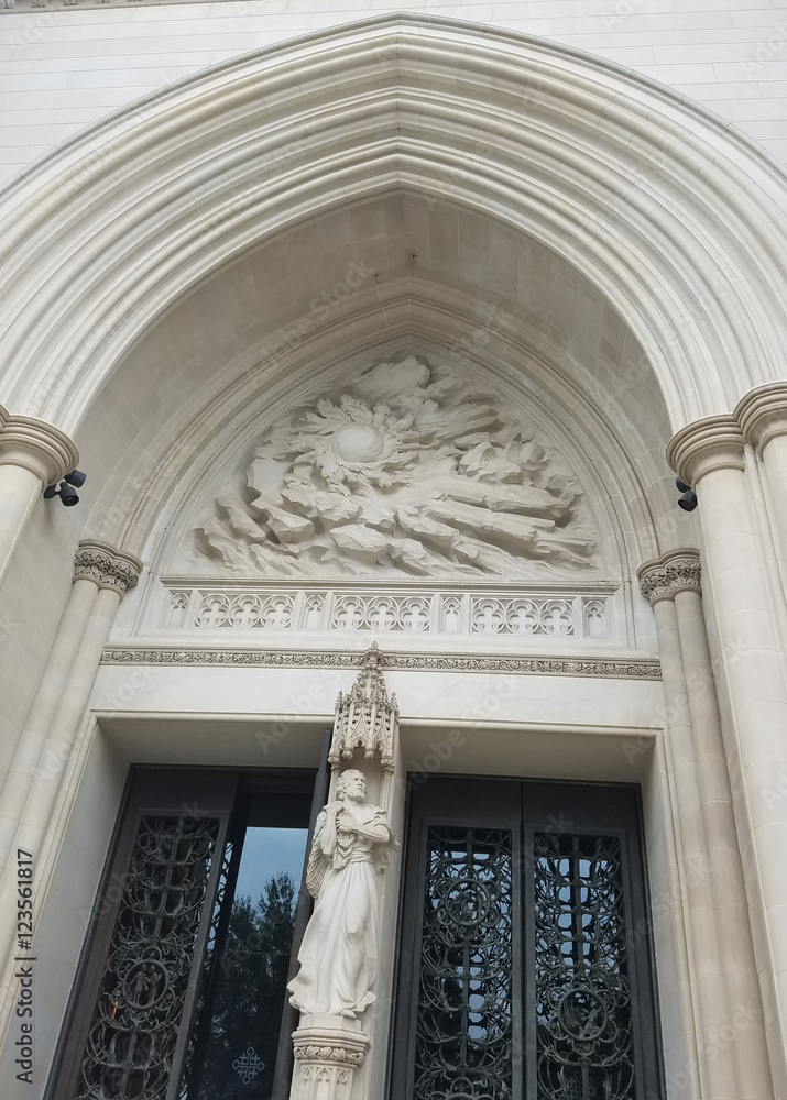 The portal of the Cathedral Church of Saint Peter and Saint Paul in the City and Diocese of Washington DC, known as The National Cathedral, with architectural and sculptural neo Gothic details.