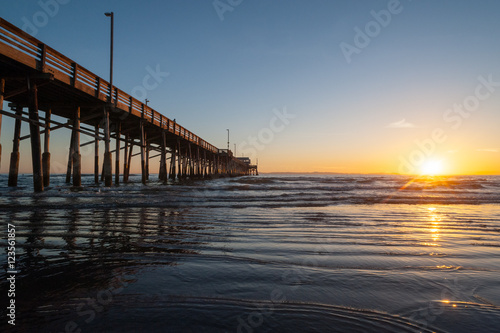 Wallpaper Mural Tide coming in during a beautiful Dramatic Sunset at Newport beach Pier in Orange county, California Torontodigital.ca