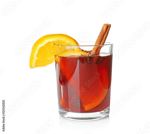 Glass of delicious Christmas mulled wine on white background