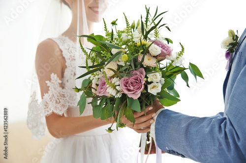 Groom giving bride beautifu...