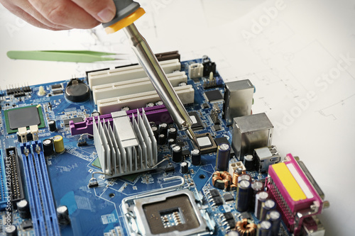 Man using soldering tool fo...