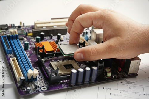 Man installing microprocess...