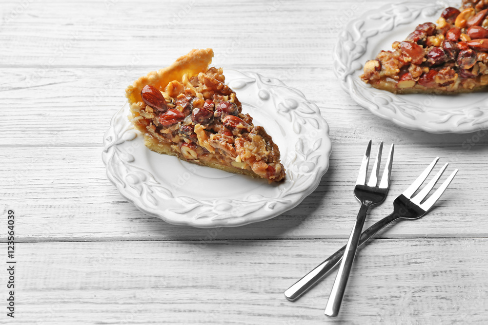 Delicious cake with nuts on table Delicious cake with nuts on table