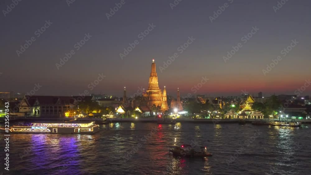 Wat Arun buddhist temple and boats on Chao Phraya river at twilight time in Bangkok, Thailand 4k
Wat Arun buddhist temple and boats on Chao Phraya river at twilight time in Bangkok, Thailand 4k