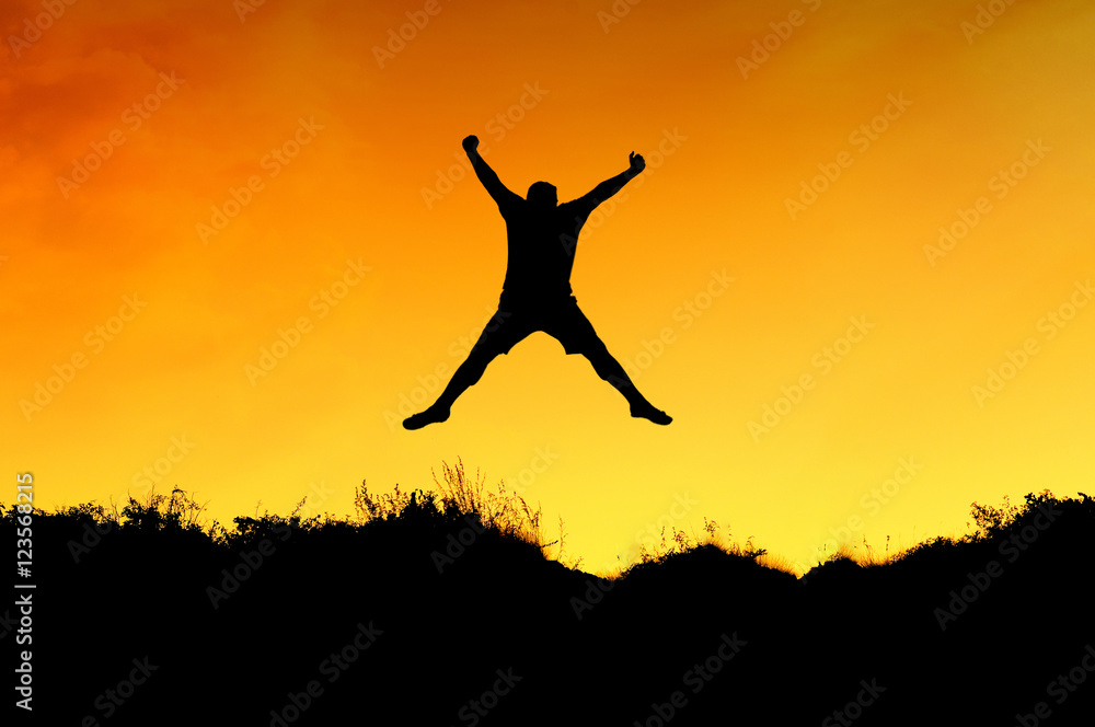 a man jump on the top of mountain and getting fun on mountains backdrop a man jump on the top of mountain and getting fun on mountains backdrop
