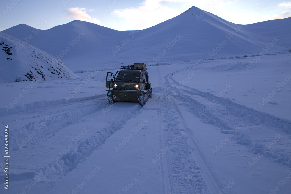 Off-road in the snowy mountains. Moma Ridge, Yakutia, Russia. Off-road in the snowy mountains. Moma Ridge, Yakutia, Russia.