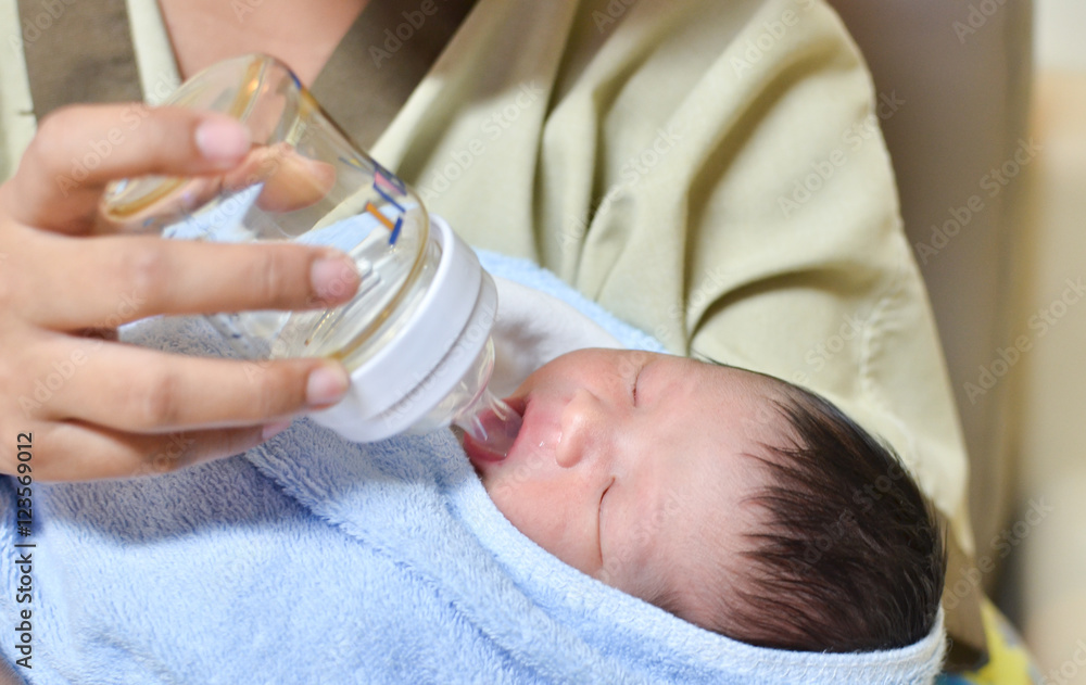 mother is feeding her newborn baby in the hospital mother is feeding her newborn baby in the hospital