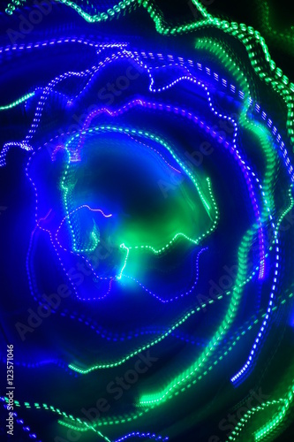 Chaotic lights in moriol blur out of focus - abstract photograph background.