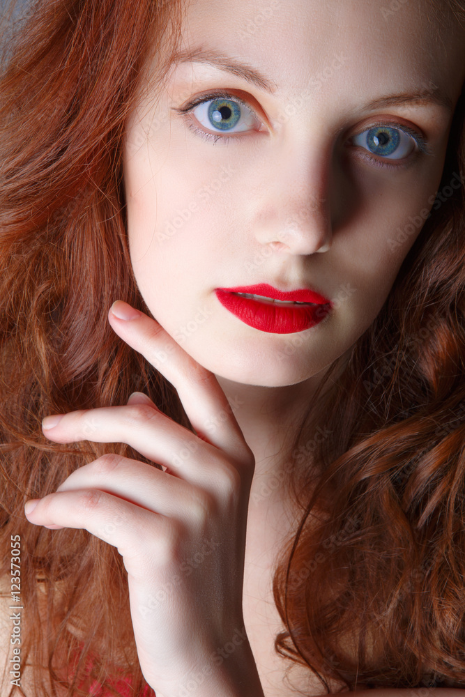 Fototapeta premium Portrait of beautiful redhead girl close up