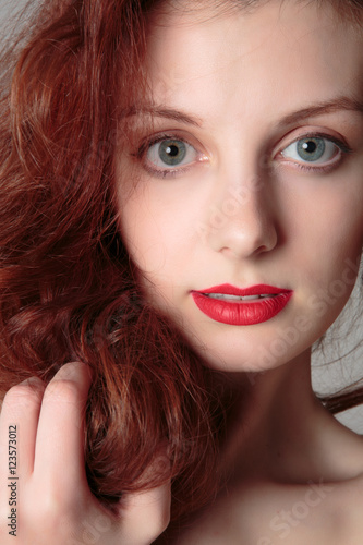 Portrait of beautiful redhead girl close up