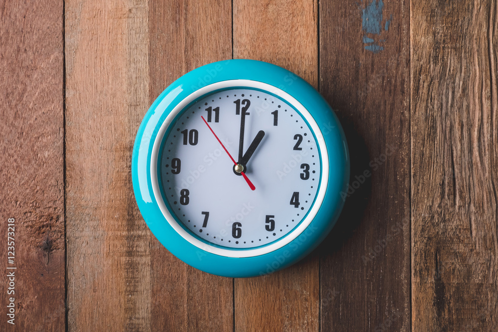 Top view of Clock on wooden table background. Top view of Clock on wooden table background.