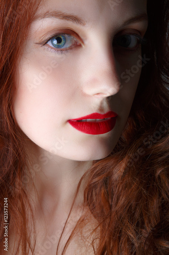 Portrait of beautiful redhead girl close up