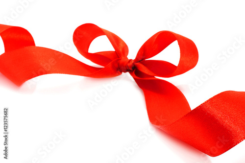 Big red holiday bow on white background