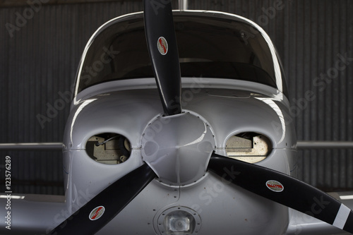 Cirrus SR20 light aircraft nicely contoured silhouette in a hangar