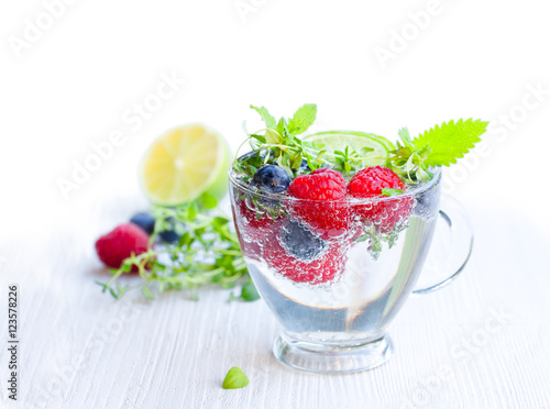 Detox water. Homemade summer fruit drink with raspberry and blu