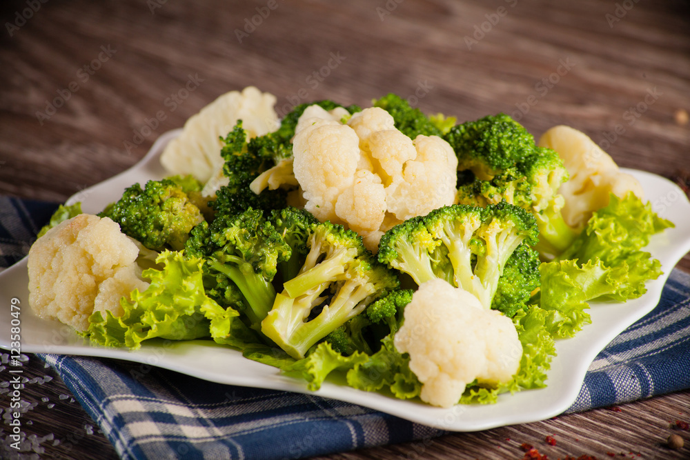cauliflower broccoli on a white plate background linen towel and