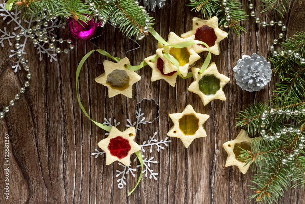 Fototapeta premium Christmas gift homemade biscuits star on the holiday table, copy