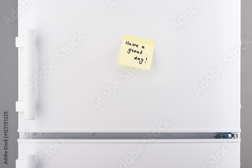 Have a great day note on light yellow sticky paper
