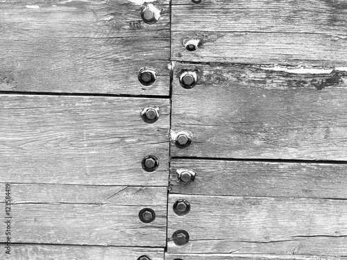 Billede på lærred Closeup of the wood and screws in personal docks in black and white