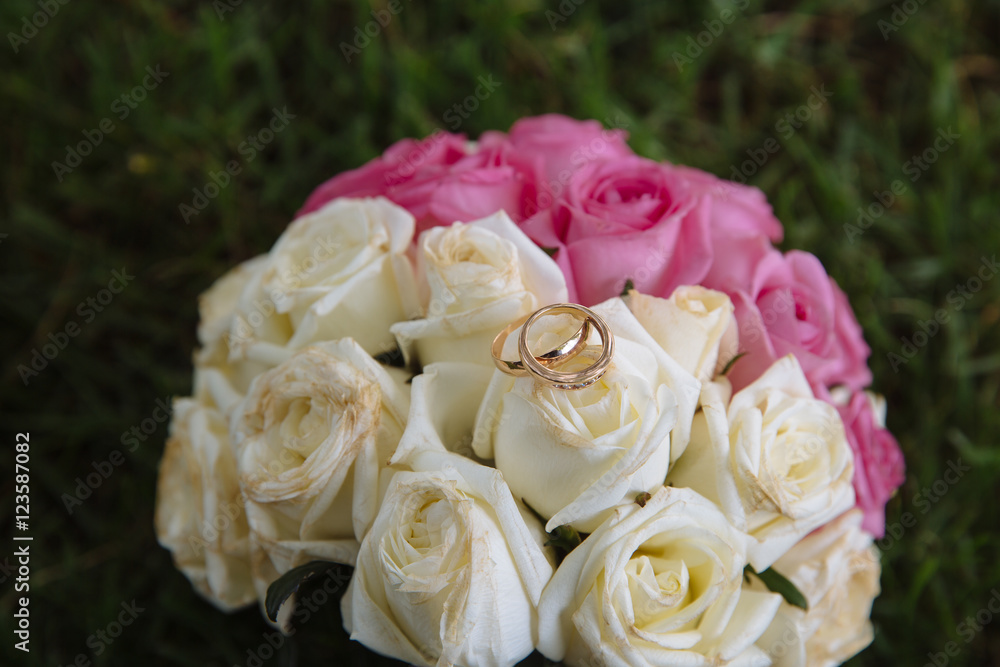 Gold rings on wedding bouquet