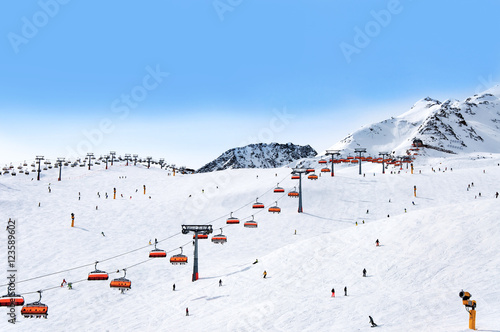 Skiers and chairlifts in Alpine ski resort in Solden in Otztal Alps, Tirol, Austria photo