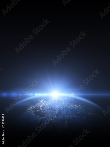 Sonnenaufgang über der Erde im Weltall photo
