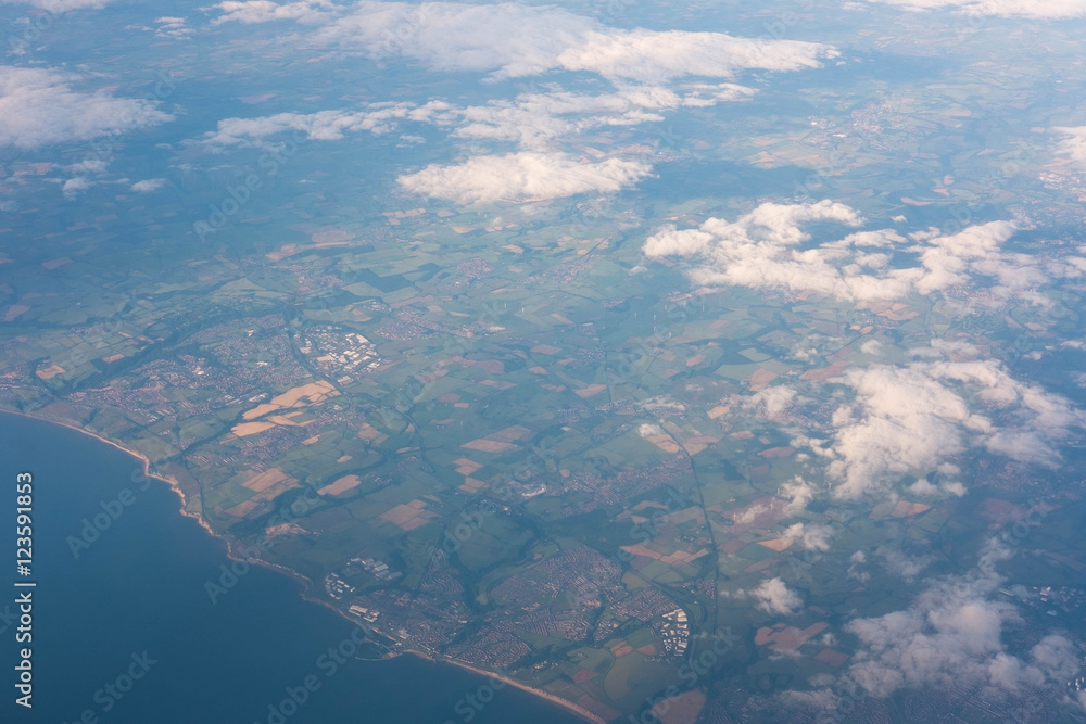 land and sea seen from airplane