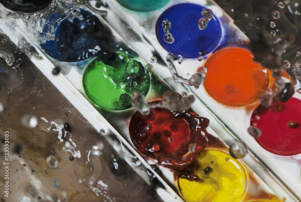 Naklejka premium photo of water splash and color paints