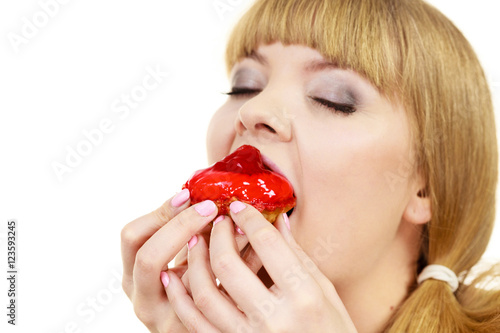 Woman eating cupcake sweet food
