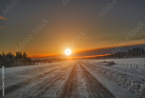 Sunset over road  Lapland Finland