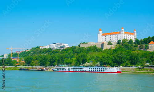 Photography view of the bratislava castle situated on a hill next to the danube river in slo