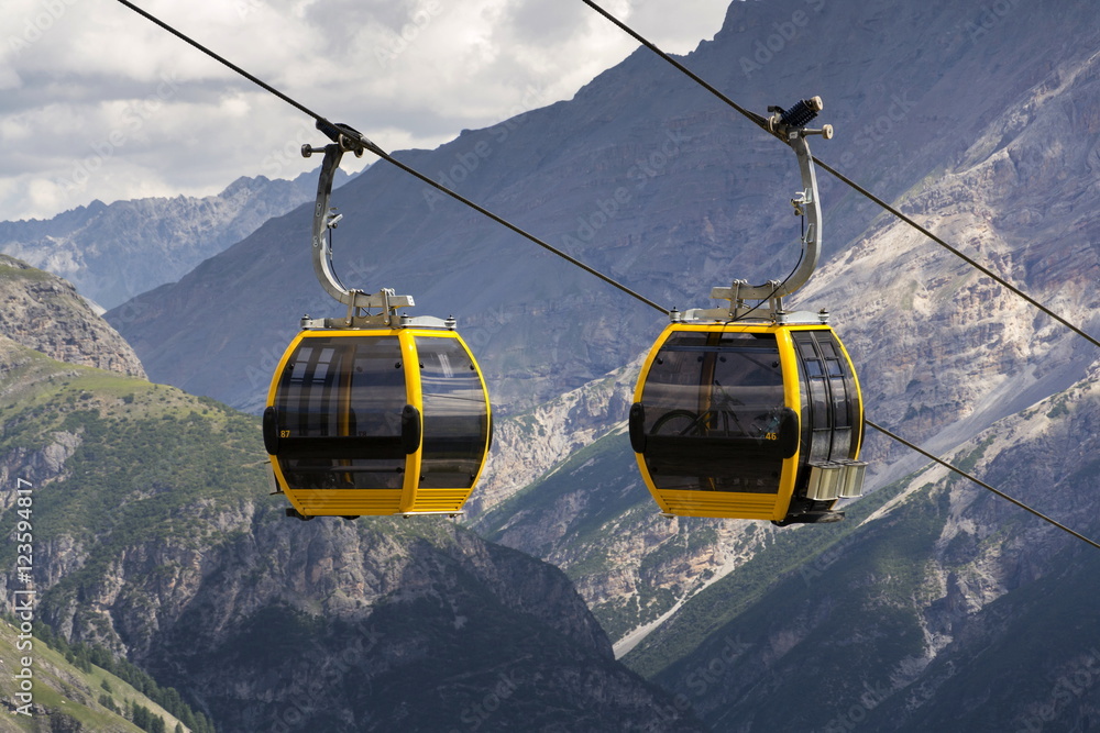 Cable car gondola in Alps mountains near Livigno lake Italy Cable car gondola in Alps mountains near Livigno lake Italy
