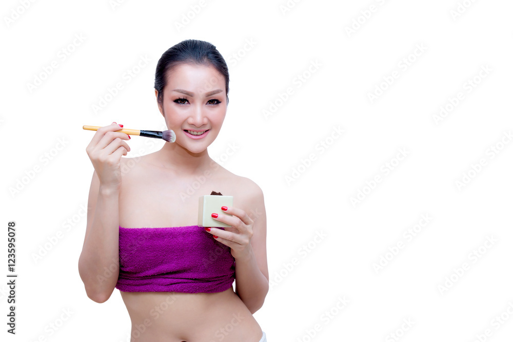 Closeup portrait of a asian woman applying dry cosmetic Closeup portrait of a asian woman applying dry cosmetic