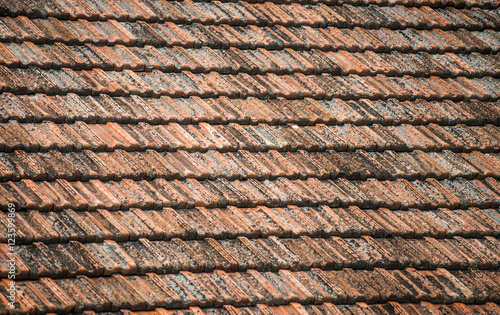 Texture of old weathered red roof tiles. 
