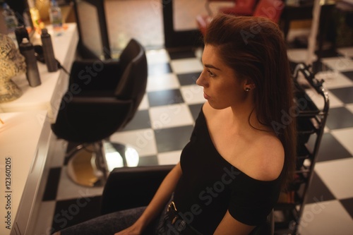 Woman sitting at hair saloon