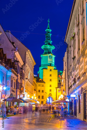 Photography Nightlife on the michalska street dominated by white michalska tower in historic