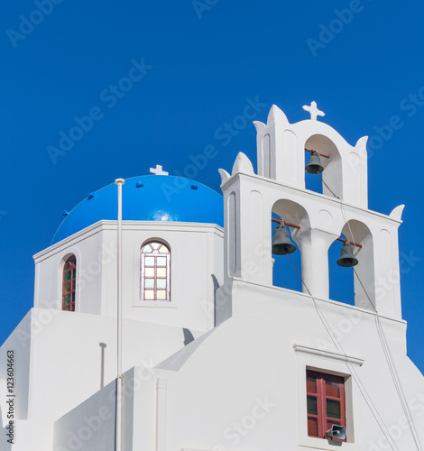 White orthodox church bell tower. Oia, Santorini Greece. Copyspace