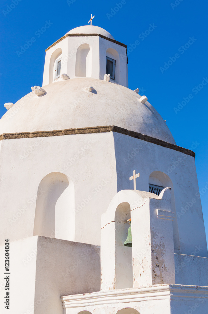 White orthodox church bell tower. Oia, Santorini Greece. Copyspace