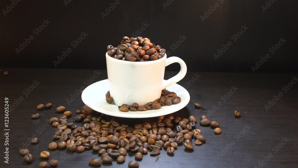 Slow motion. Coffee Grains Falling In White Cup Slow motion. Coffee Grains Falling In White Cup