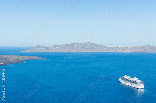 Luxury cruise ships, caldera and volcano near Fira, capital of the Greek Aegean island, Santorini, Greece. Panorama