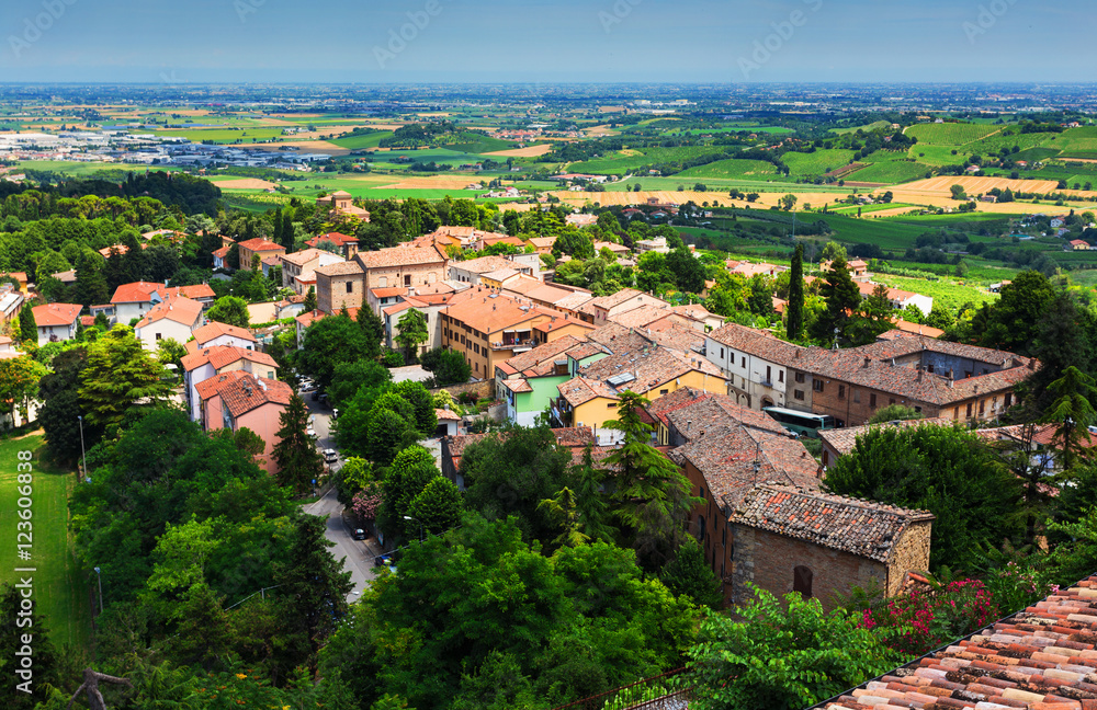 agricultural landscape with old village in toscana