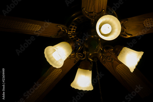 Ceiling fan with lights. Decorative ventilation with lamps on th