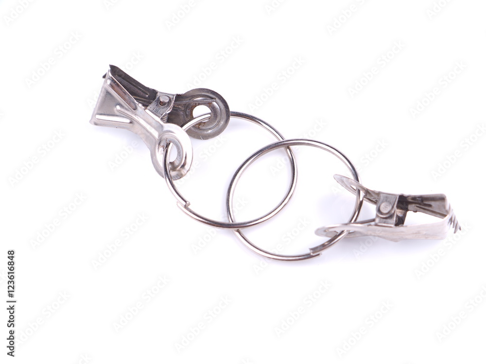 Metal fasteners for curtains on a white background Metal fasteners for curtains on a white background