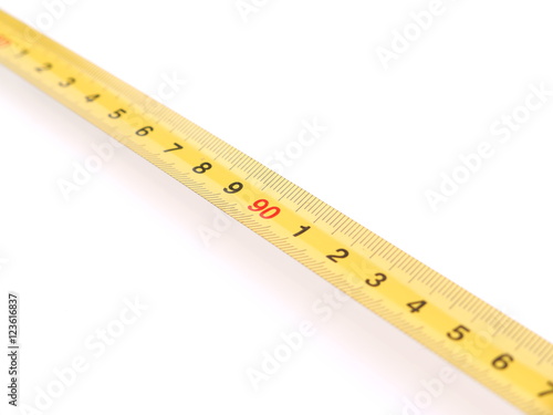 yellow measuring tape on white background