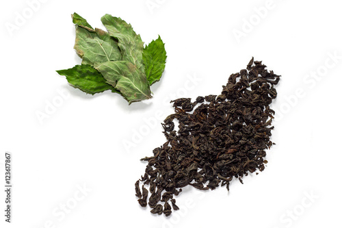 Dry tea leaves and mint. In isolation.