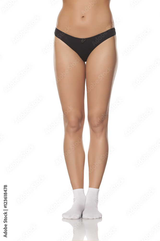beautifully cared feminine legs in a white socks and black panties beautifully cared feminine legs in a white socks and black panties