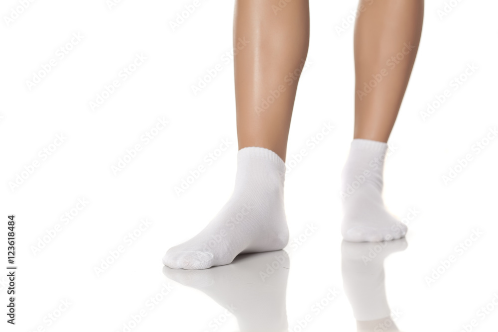 female feet in a white socks