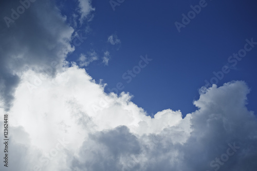White clouds cover deep blue sky