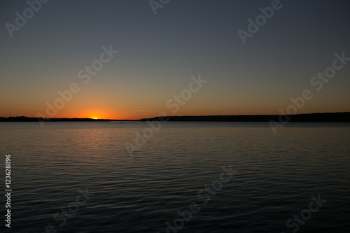Sunset on a calm lake in Ontario Canada © Gideon