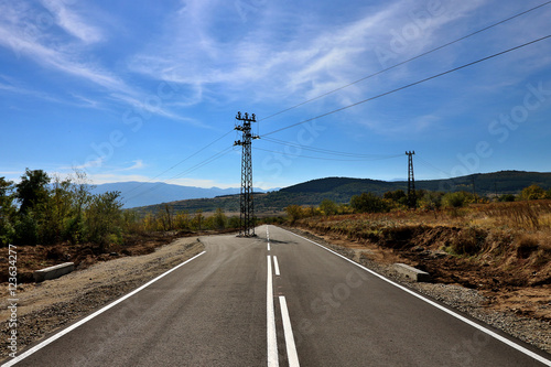 Fototapeta Naklejka Na Ścianę i Meble -  power pole in the middle of the road in Bulgaria